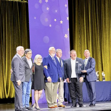 Travel Quest Network Founders Accept Award