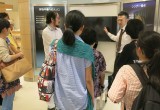 Volunteer tours guests through the Church's Public Information Center panels on the Church-supported drug prevention initiative.