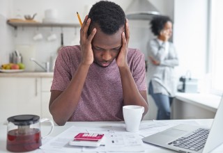 Man Stressed by Finances