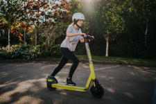 Woman riding e-scooter