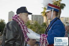 Band Member presenting Lei to Pearl Harbor Survivor