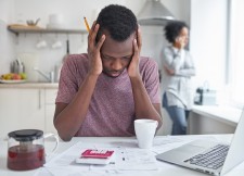 Man Stressed by Finances