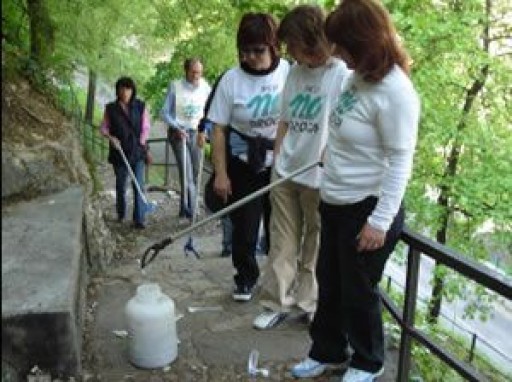 Scientology Volunteers Hold Syringe Clean Up