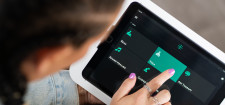 A patient uses Volo in-room tablets at a Flyland Recovery facility