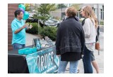 A volunteer from the Seattle chapter of the Foundation for a Drug-Free World briefed neighbors on the purpose and scope of the campaign.