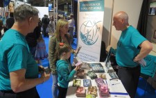 A mother, happy to introduce her daughter to the truth about drugs with the Foundation for a Drug-Free World booklets  